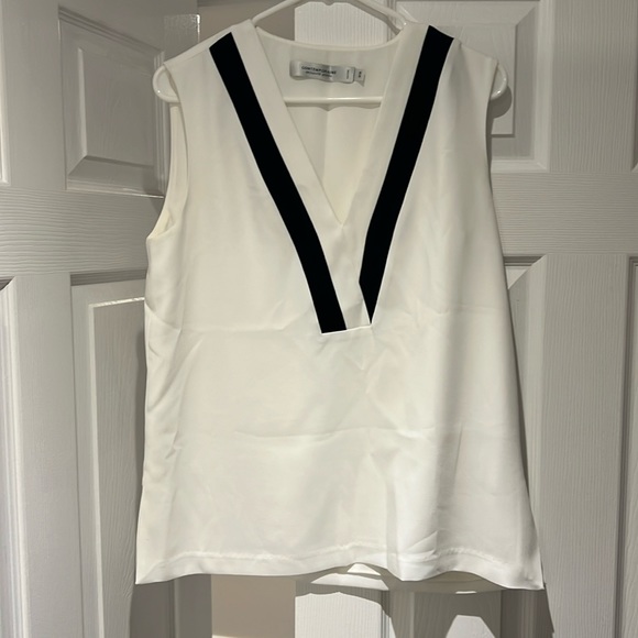 Simons Contemporaire top. Black and white varsity look. Crepe material. Size M - Picture 1 of 3